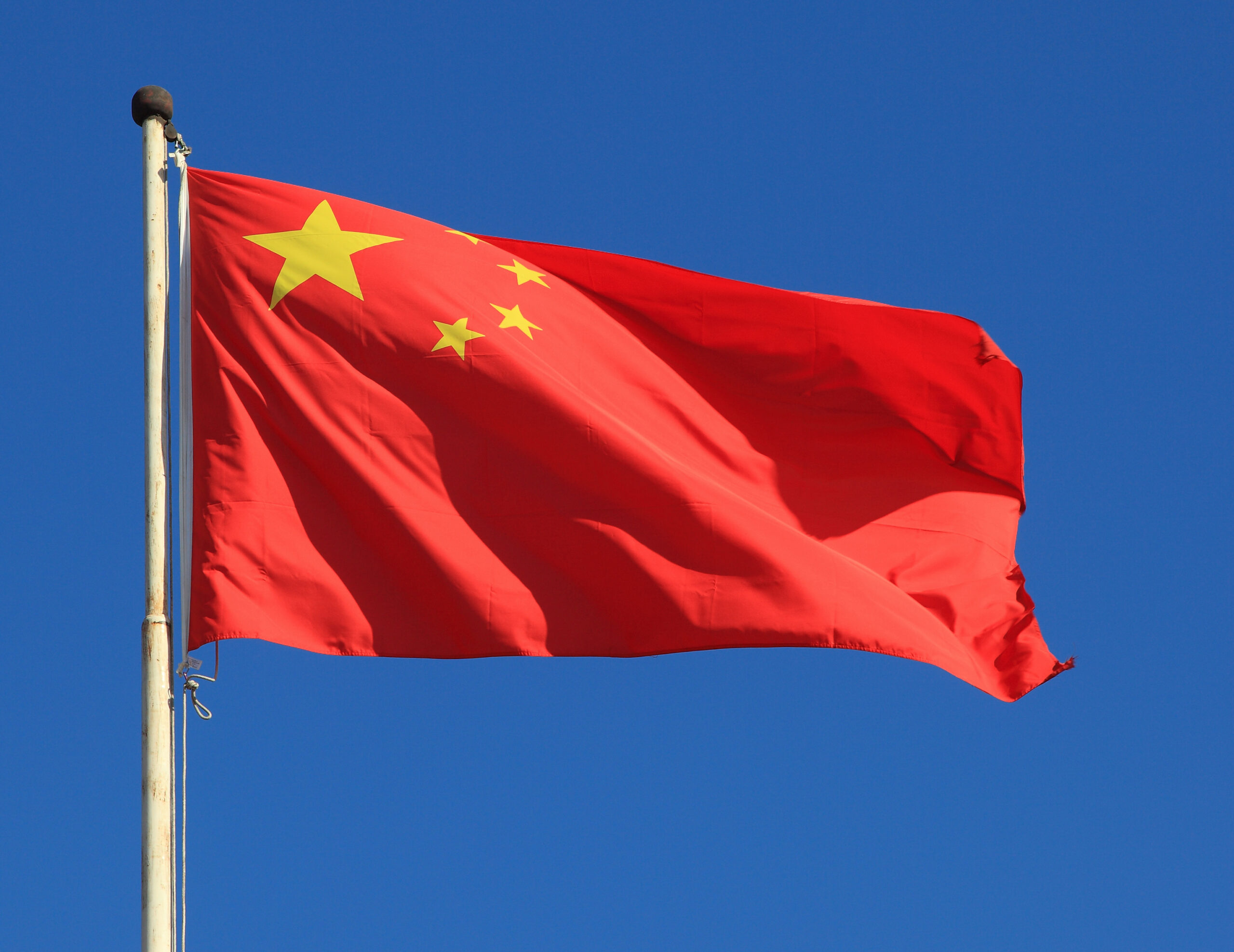 chinese,national,flag,with,blue,sky,as,background