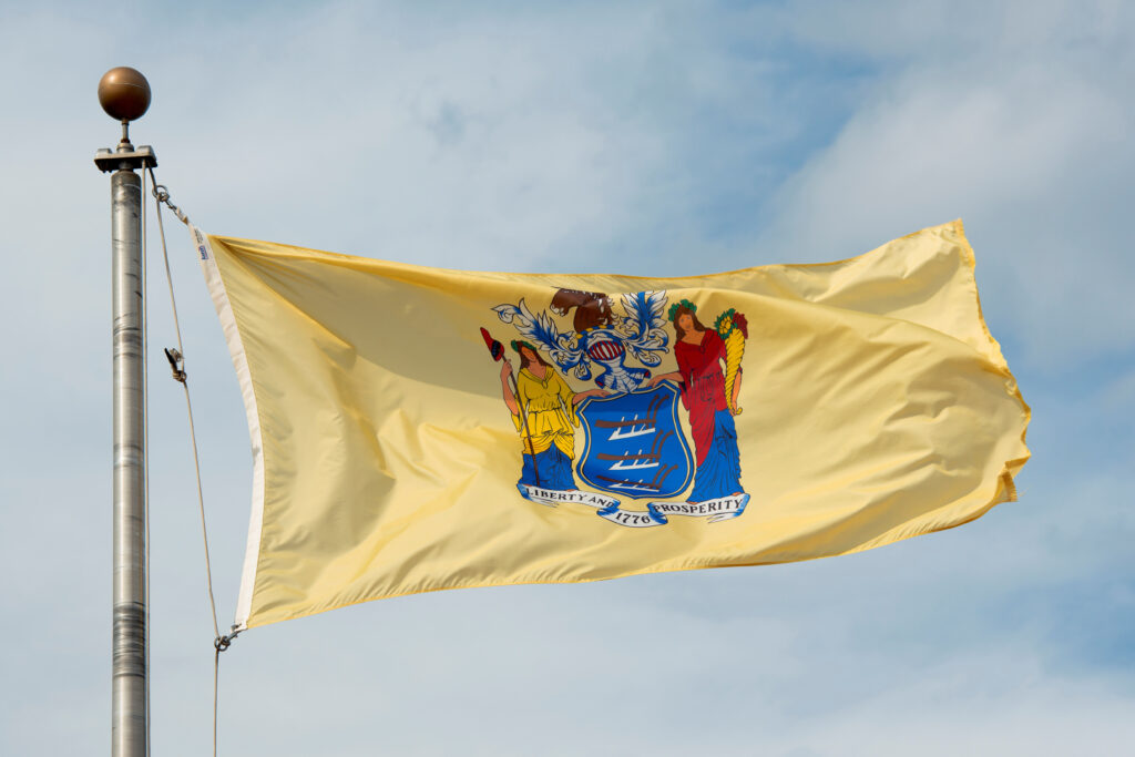 flag,of,new,jersey,in,front,of,new,jersey,state