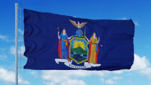 new,york,flag,on,a,flagpole,waving,in,the,wind,