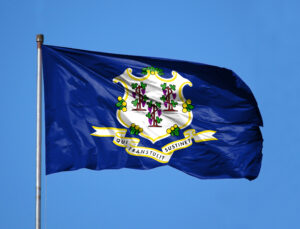 national,flag,state,of,connecticut,on,a,flagpole