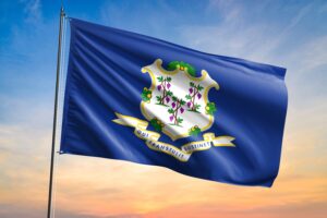 flag,of,connecticut,waving,flag,on,sunset,view
